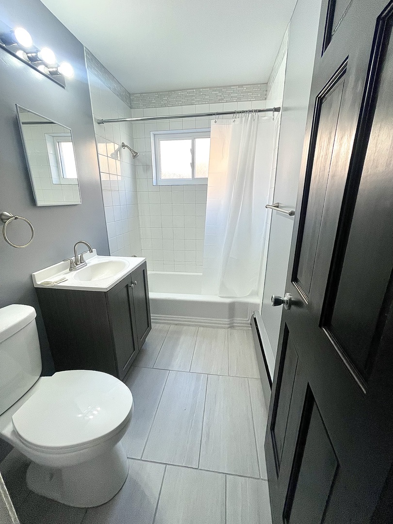 3642 147th Place Midlothian, IL 60445 - Photo 10 of 16 a bathroom with a sink toilet and shower