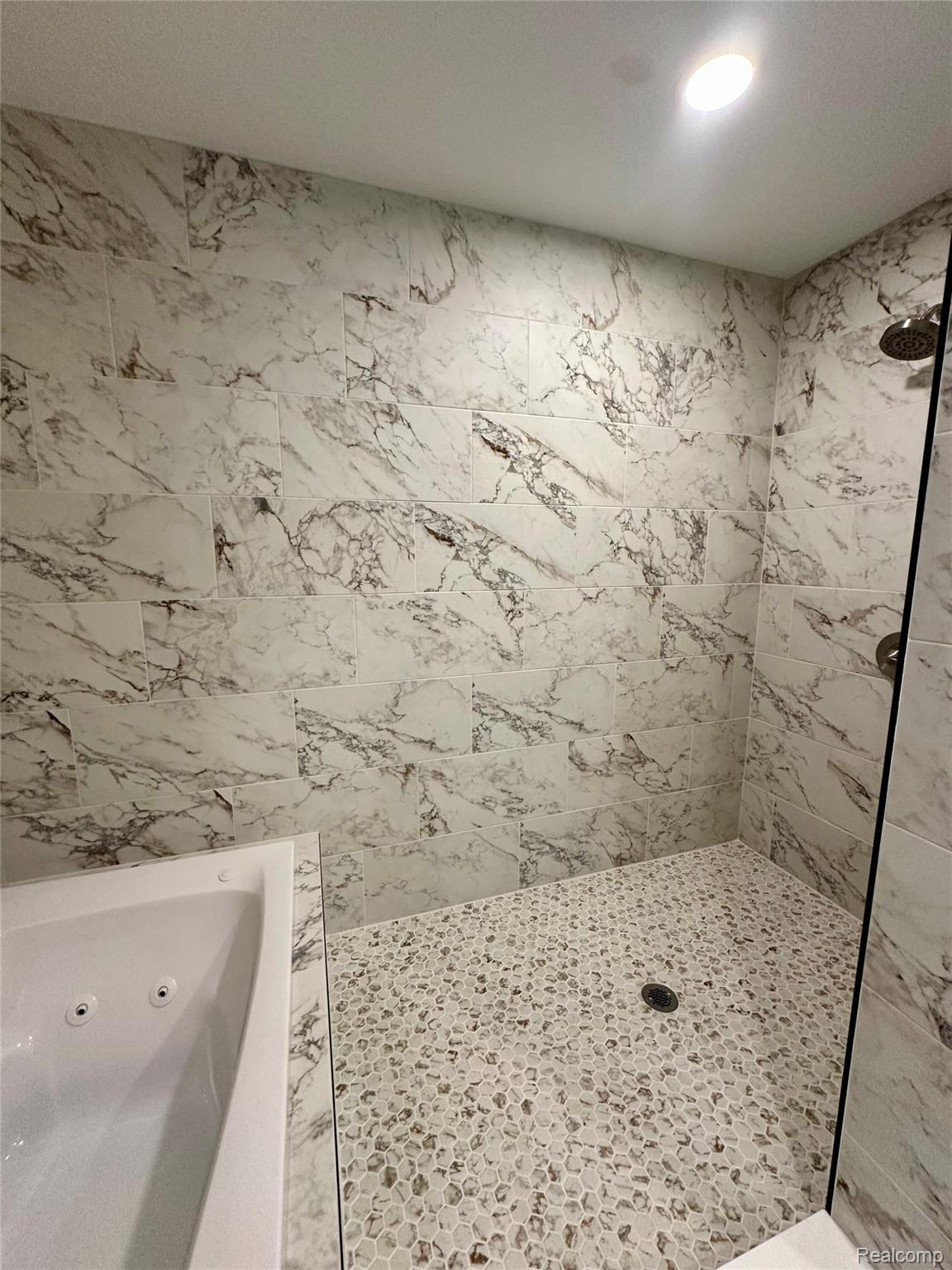 2670 Riley Center Road Memphis, MI 48041 - Photo 21 of 39 Bathroom with a jetted tub, tiled shower, and tile walls