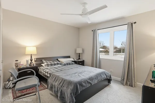 a bedroom with a bed and window