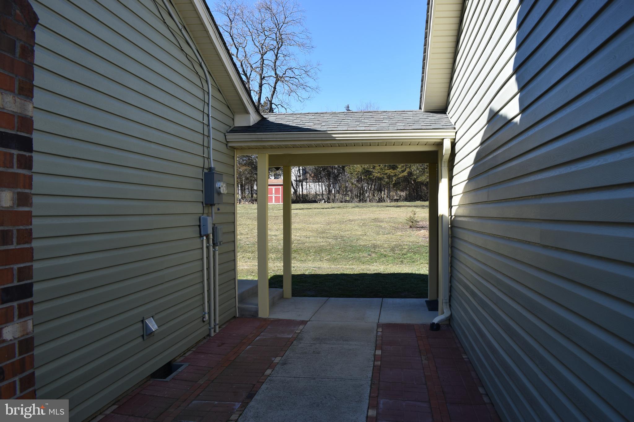 211 Lake Ridge Road Strasburg, VA 22657 - Photo 19 of 27 Walkway from Garage to house