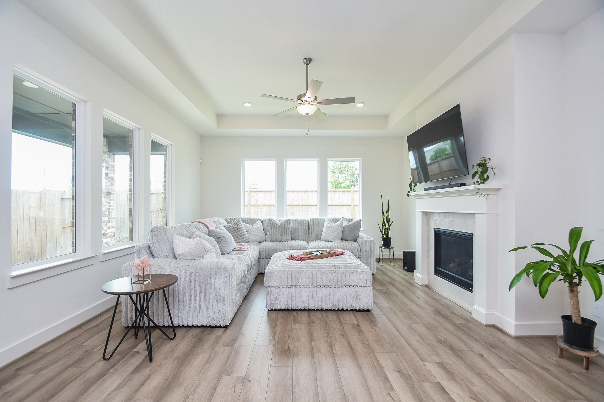 31915 Sky Rdg Lane Fulshear, TX 77441 - Photo 12 of 38 This living room invites you to relax in its warm, cozy embrace, blending comfort with elegance for the perfect home retreat.