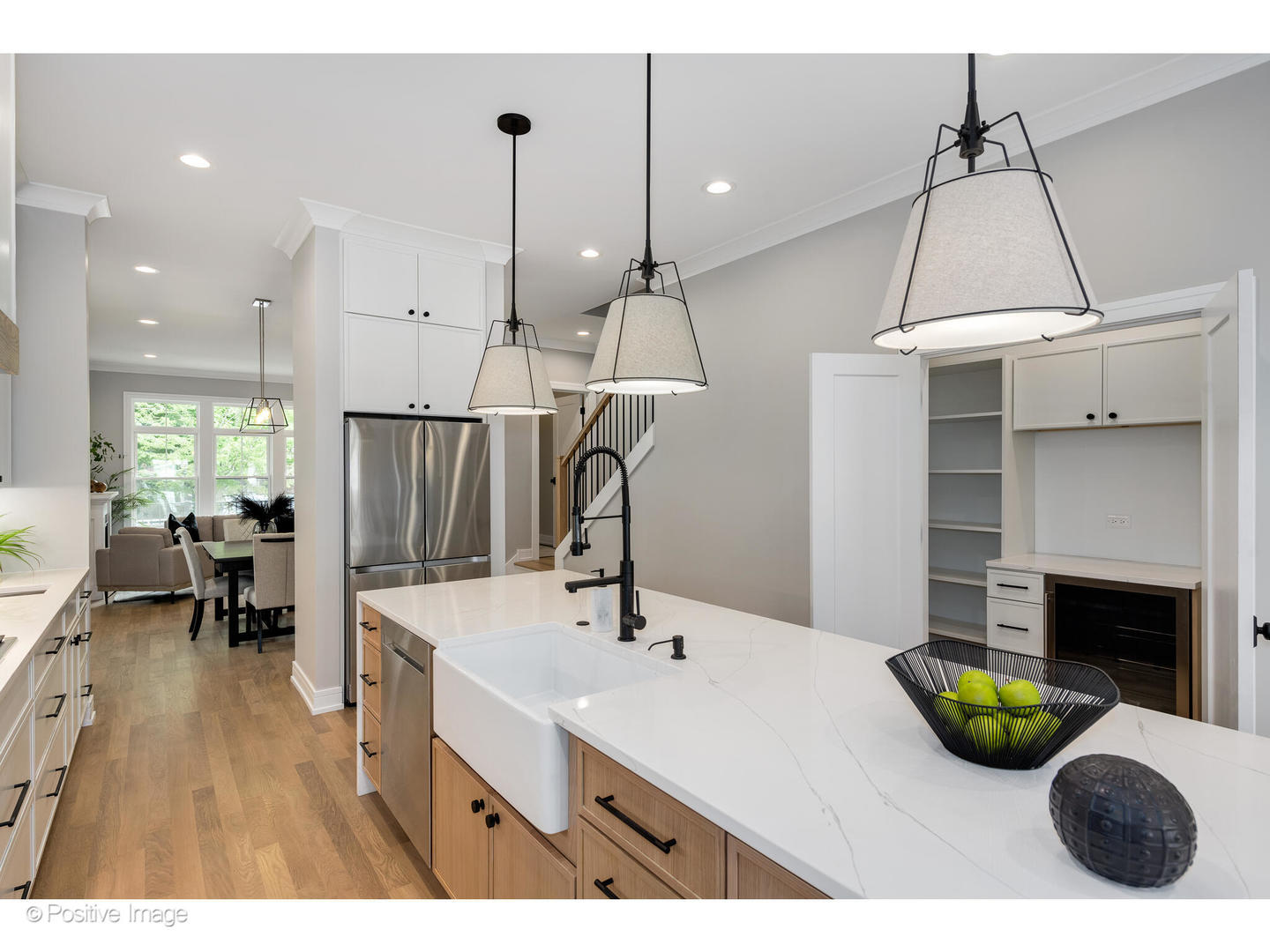 3107 North Oakley Avenue Chicago, IL 60618 - Photo 12 of 28 a kitchen with a sink a refrigerator and chairs