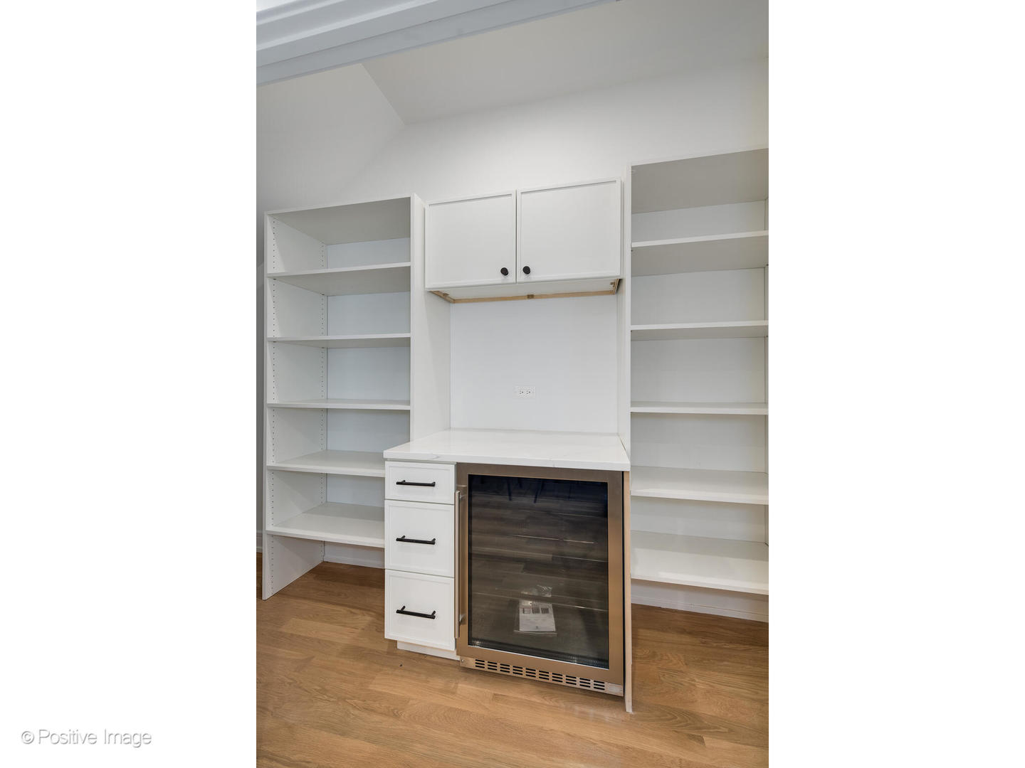 3107 North Oakley Avenue Chicago, IL 60618 - Photo 13 of 28 a living room with a chair and a fireplace