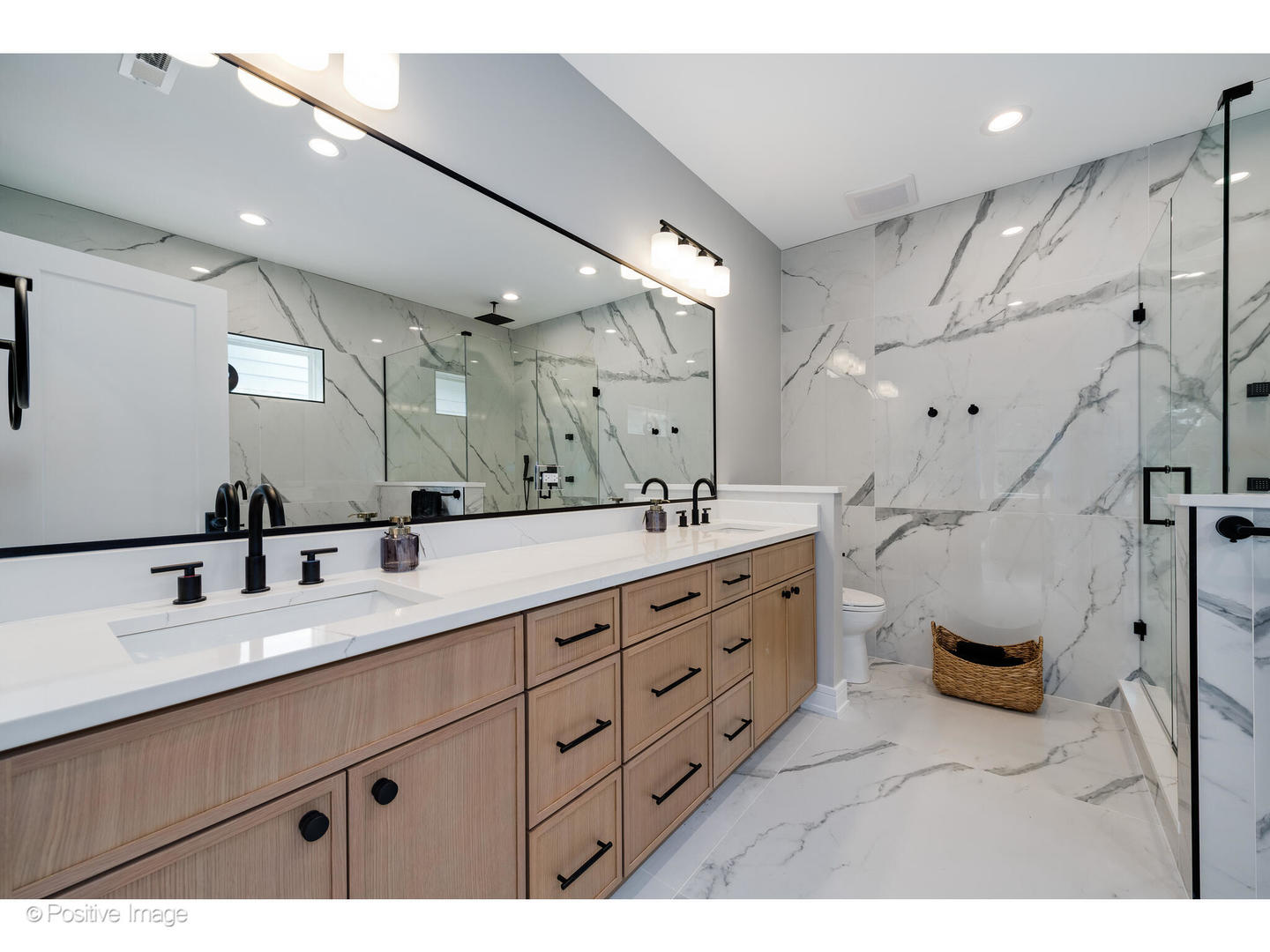 3107 North Oakley Avenue Chicago, IL 60618 - Photo 25 of 28 a spacious bathroom with double vanity sink a mirror and a shower