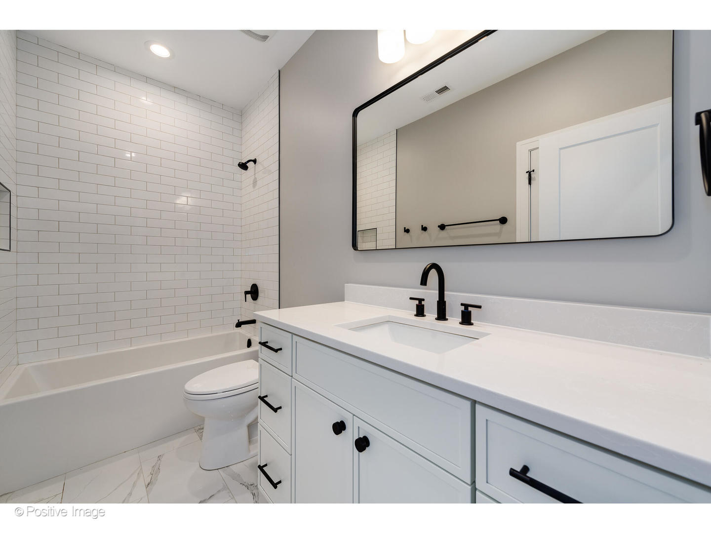 3107 North Oakley Avenue Chicago, IL 60618 - Photo 28 of 28 a bathroom with a sink a toilet and bathtub