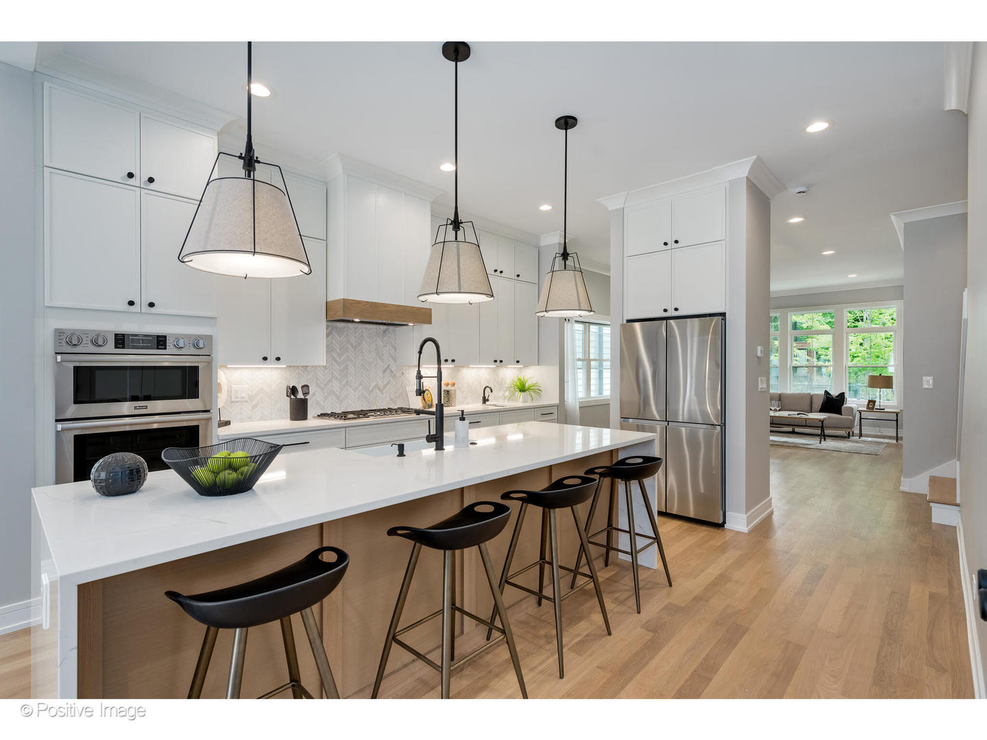 3107 North Oakley Avenue Chicago, IL 60618 - Photo 8 of 28 a kitchen with a table a refrigerator and chairs