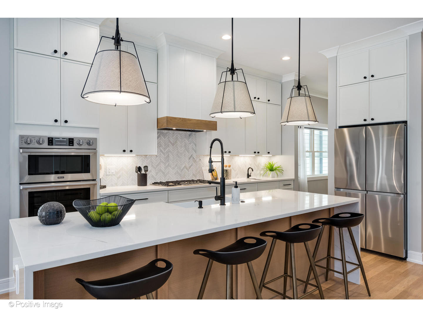 3107 North Oakley Avenue Chicago, IL 60618 - Photo 9 of 28 a kitchen with kitchen island a counter space a sink appliances and cabinets