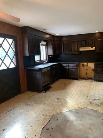 a view of an empty room with a fireplace