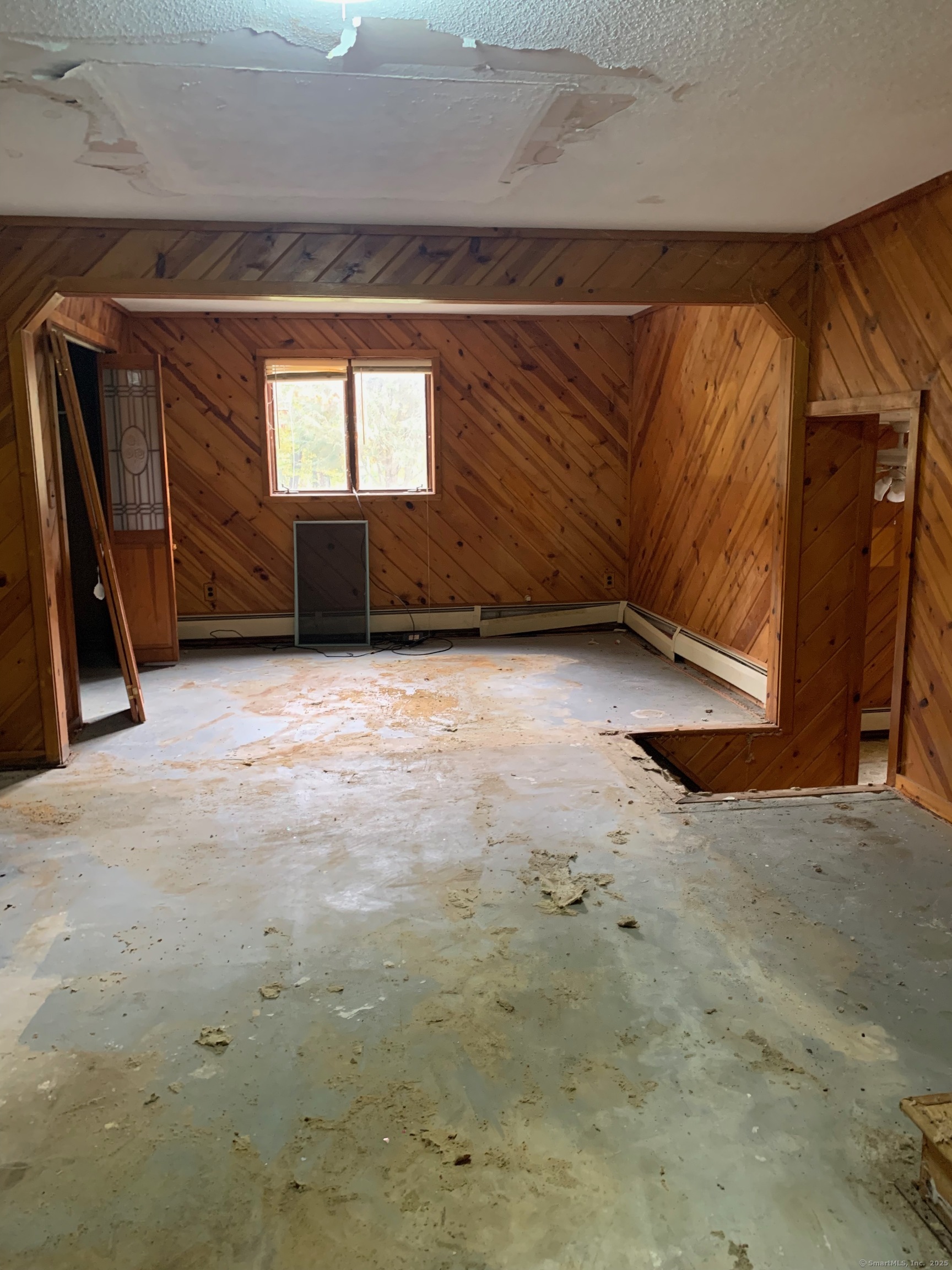 99 Obtuse Hill Road Brookfield, CT 06804 - Photo 16 of 31 a view of an empty room with a fireplace