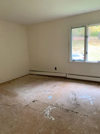 a view of a livingroom with an empty space and window