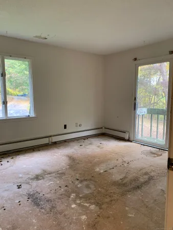 a view of bedroom with wooden floor