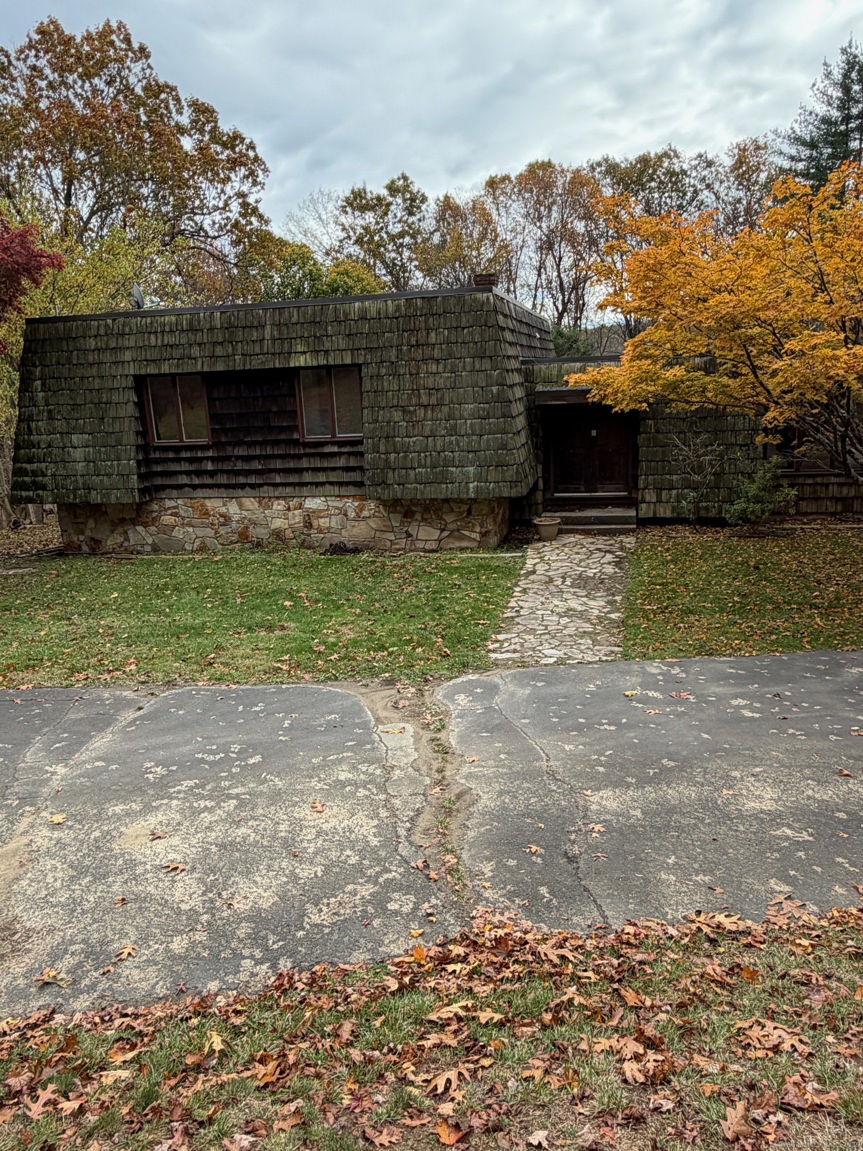 99 Obtuse Hill Road Brookfield, CT 06804 - Photo 2 of 31 a front view of a house with a yard