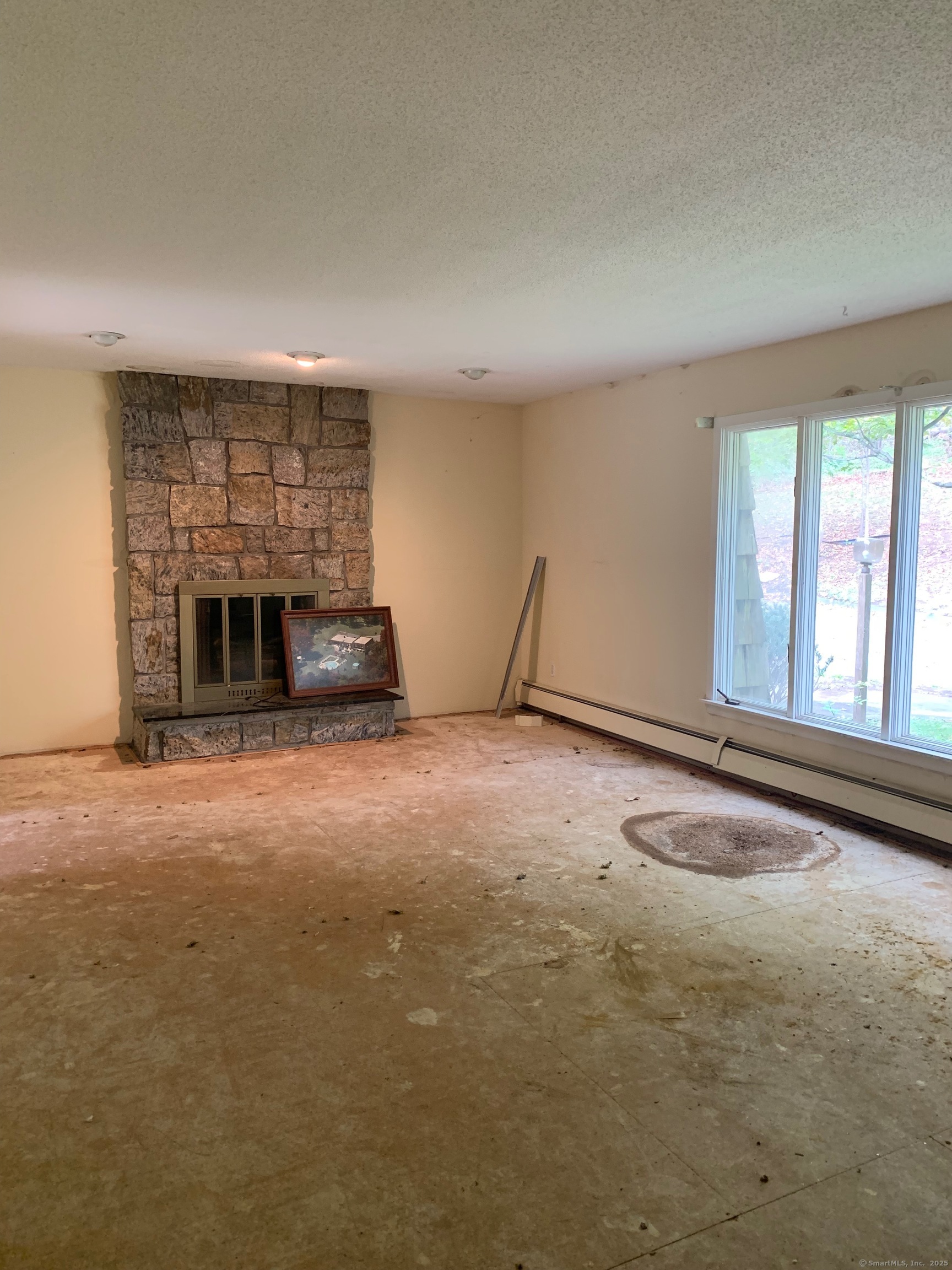 99 Obtuse Hill Road Brookfield, CT 06804 - Photo 26 of 31 a living room with furniture and a fireplace