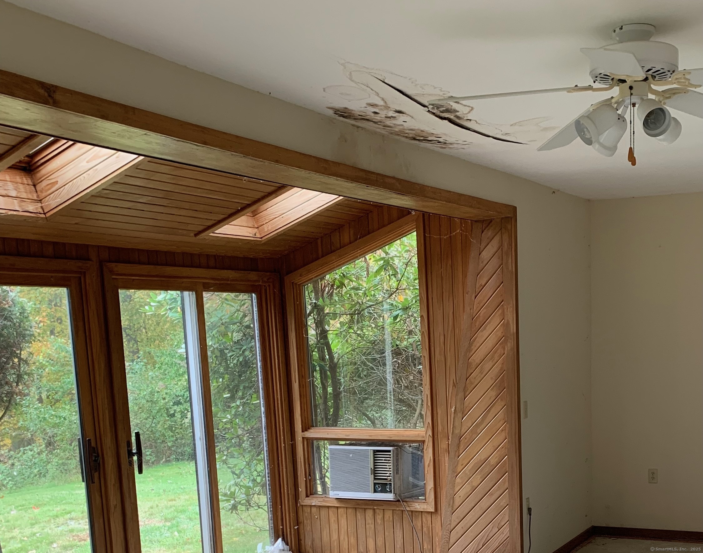 99 Obtuse Hill Road Brookfield, CT 06804 - Photo 30 of 31 a view of a porch with furniture and floor to ceiling window