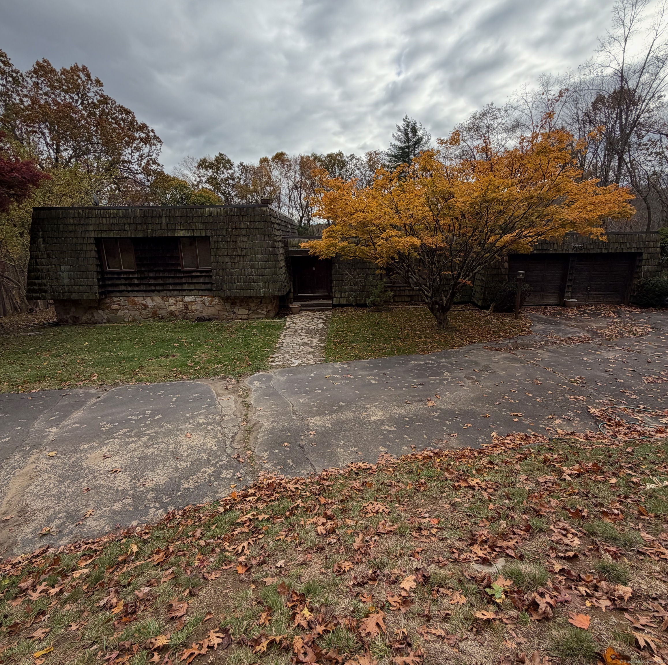 99 Obtuse Hill Road Brookfield, CT 06804 - Photo 6 of 31 a view of a yard and car parked