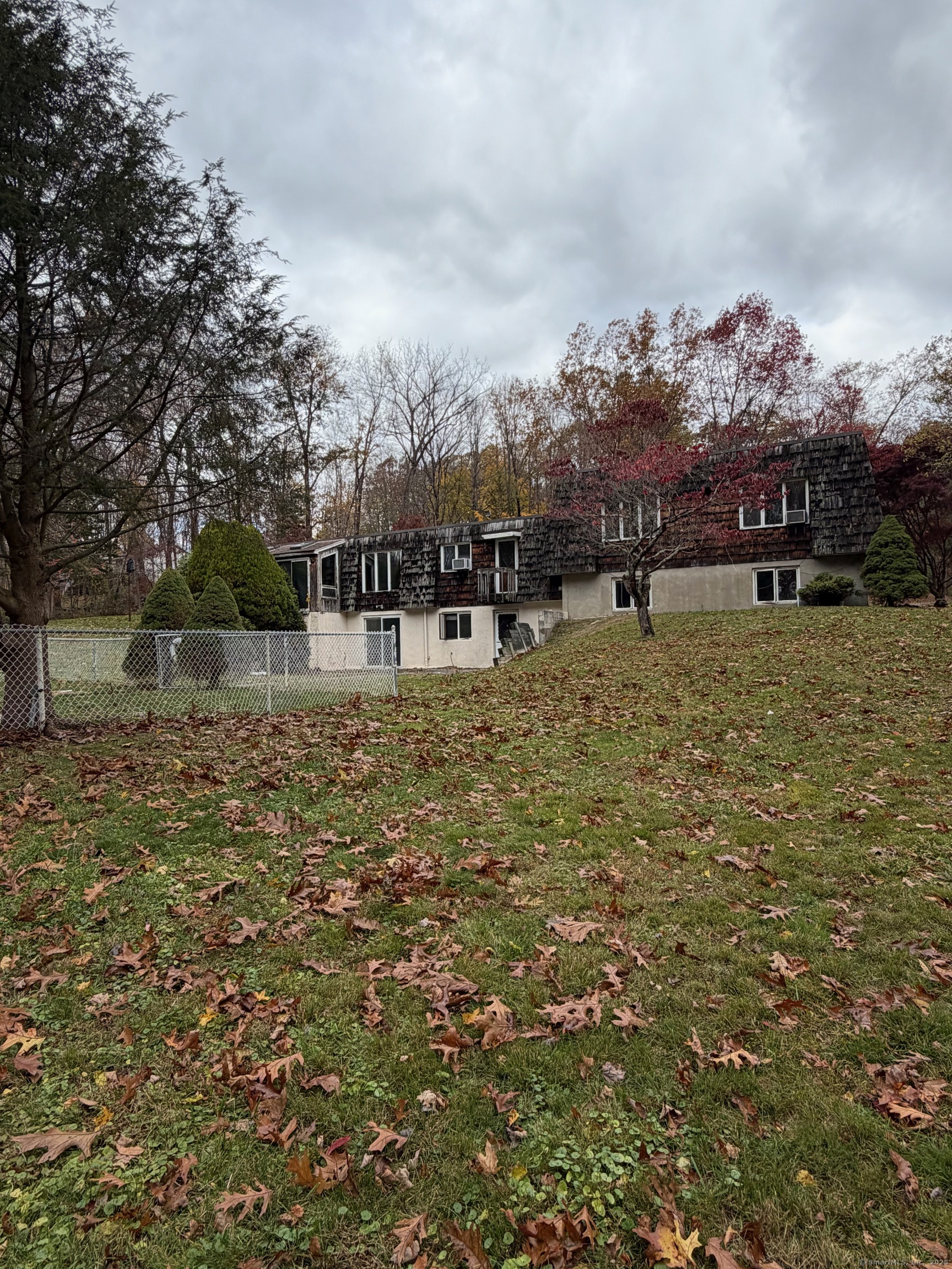 99 Obtuse Hill Road Brookfield, CT 06804 - Photo 9 of 31 a view of swimming pool with outdoor seating and covered with trees