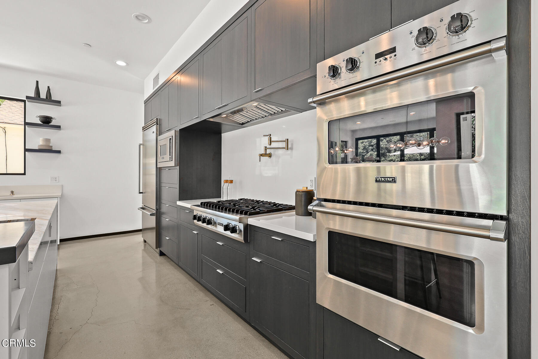 2065 Oakdale Street Pasadena, CA 91107 - Photo 2 of 7 a kitchen with granite countertop white cabinets and white appliances