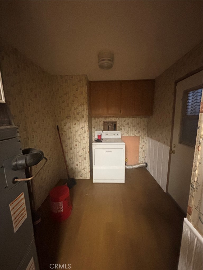 22840 Cajalco Road Perris, CA 92570 - Photo 6 of 8 a storage room with washer and dryer