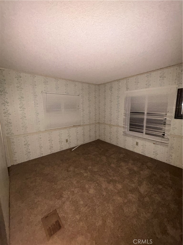 22840 Cajalco Road Perris, CA 92570 - Photo 7 of 8 an empty room with a empty space