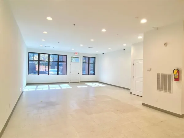 a white toilet sitting next to a bathroom sink