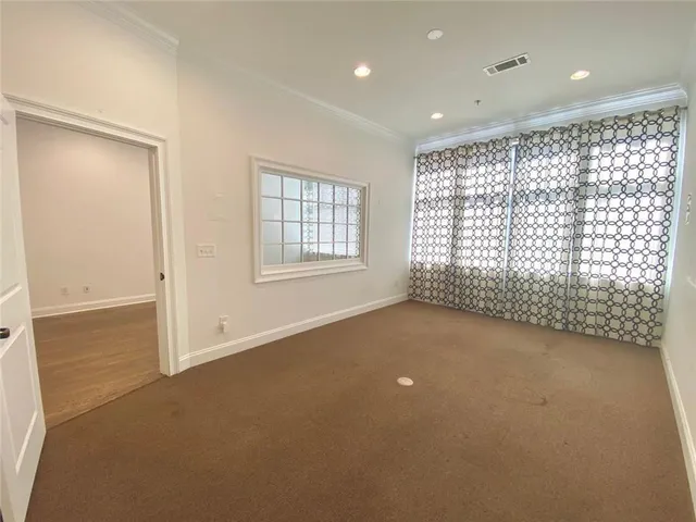 a view of an empty room and window