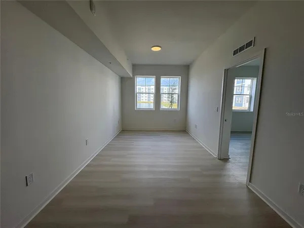 an empty room with windows