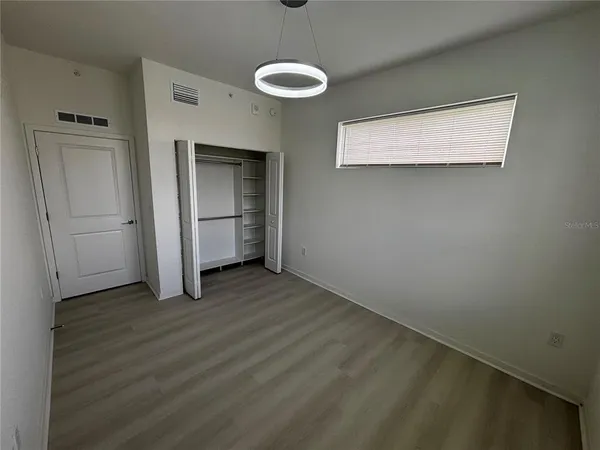 a kitchen with stainless steel appliances granite countertop a refrigerator sink and stove