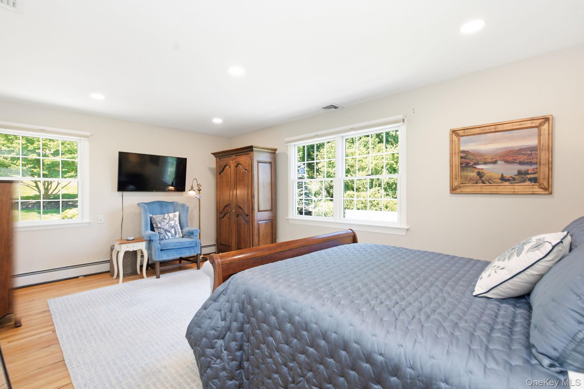 32 Bedell Road Katonah, NY 10536 - Photo 25 of 49 The spacious primary suite enjoys recessed lighting and backyard views.