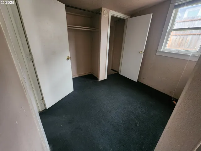 a view of a closet in an empty room