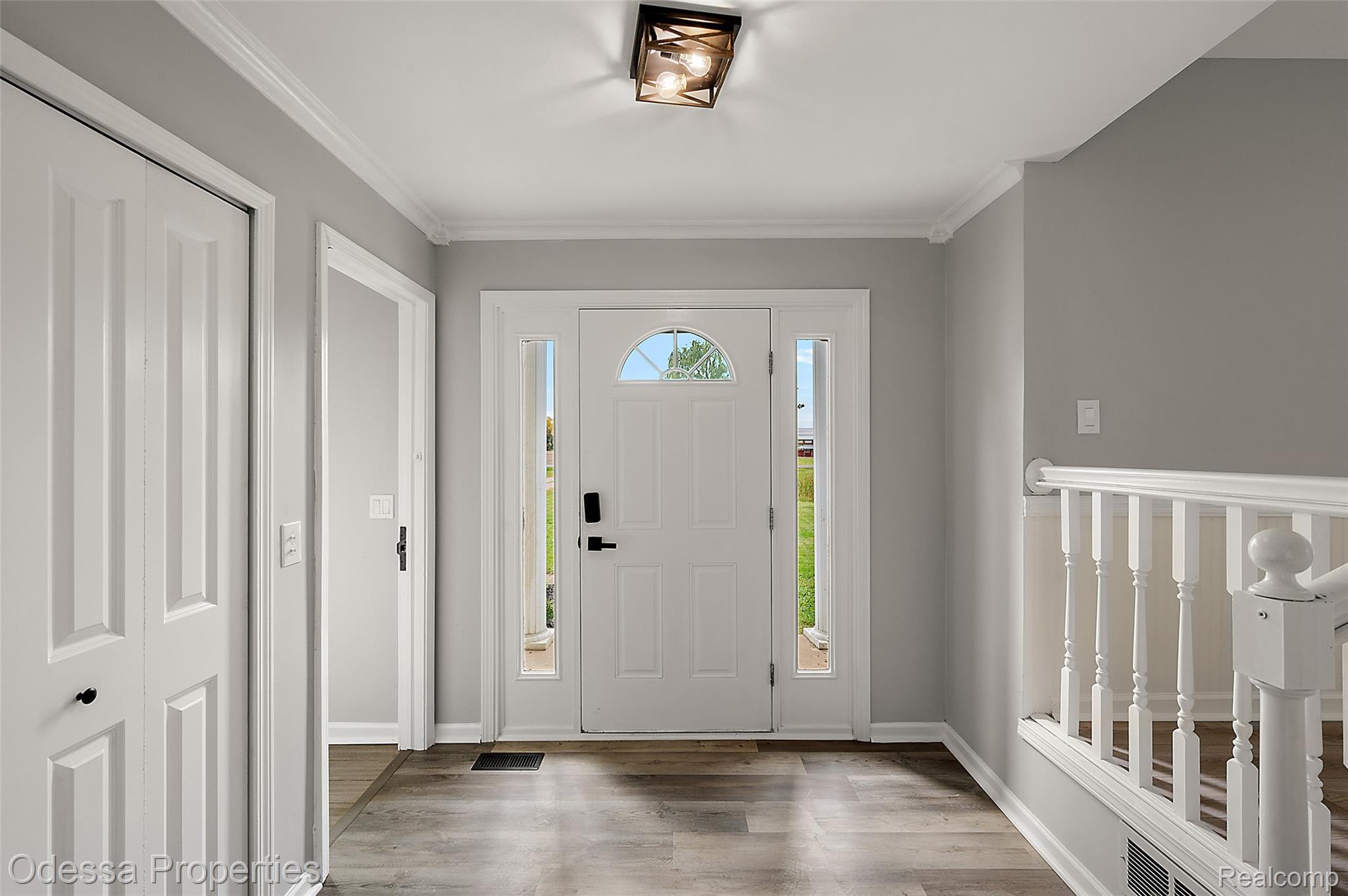 1442 Riley Center Road Memphis, MI 48041 - Photo 5 of 62 Entrance foyer with wood finished floors and ornamental molding