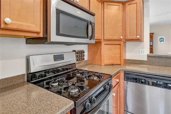 a kitchen with a stove and a microwave
