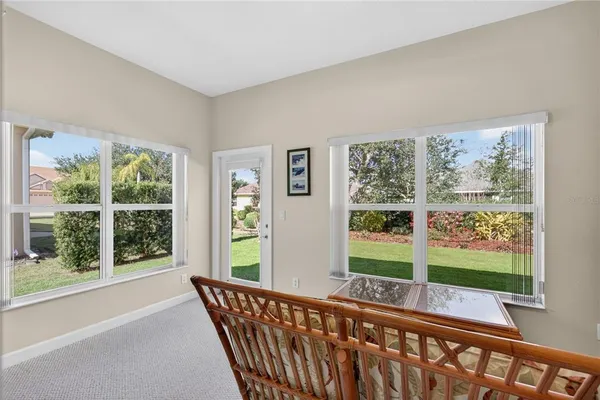 a view of a porch with wooden floor and outdoor space