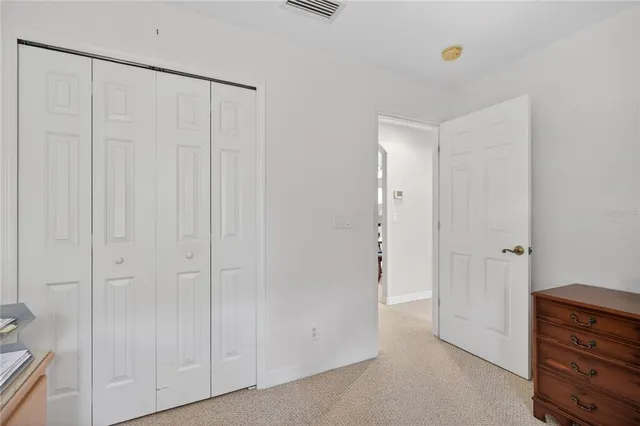 an aerial view of multiple houses with yard
