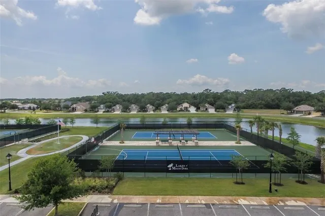 a view of a swimming pool with a patio