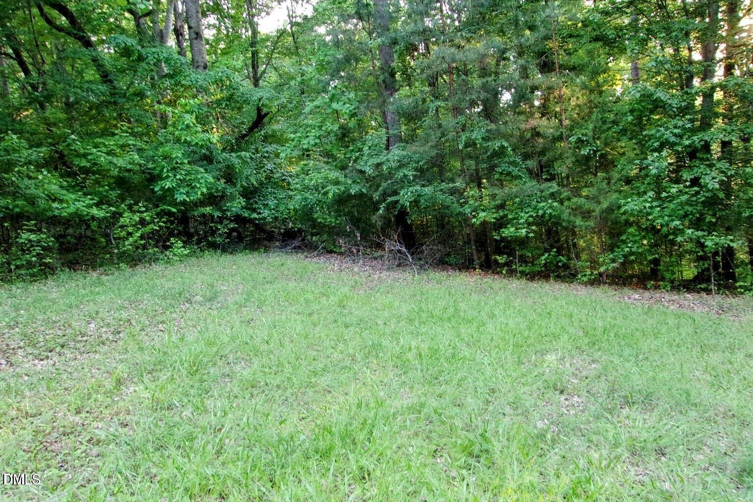 297 Fork Junction Road Timberlake, NC 27583 - Photo 2 of 4 a view of an outdoor space with a lake view