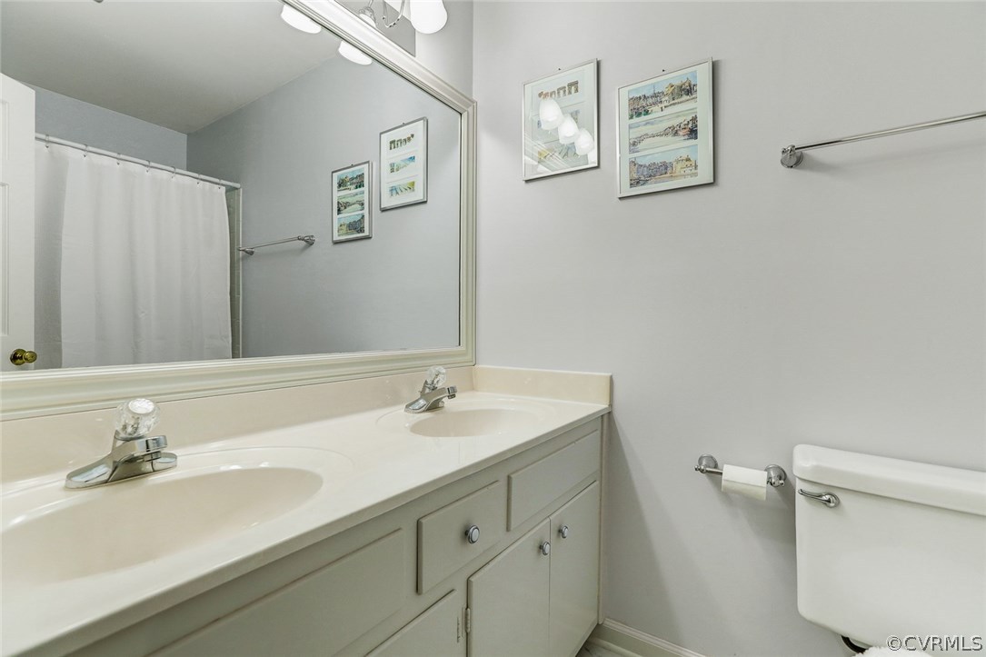 11431 Rochelle Road Chester, VA 23831 - Photo 20 of 23 a bathroom with a sink and a mirror
