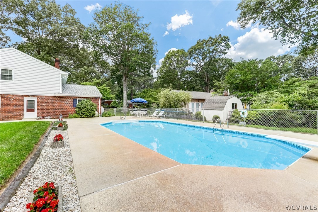 11431 Rochelle Road Chester, VA 23831 - Photo 2 of 23 a view of a swimming pool with a lounge chair