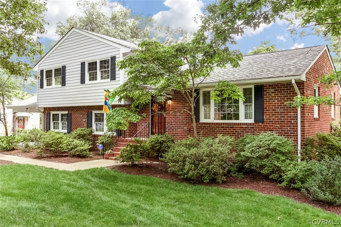 11431 Rochelle Road Chester, VA 23831 - Photo 22 of 23 a front view of a house with a yard and porch