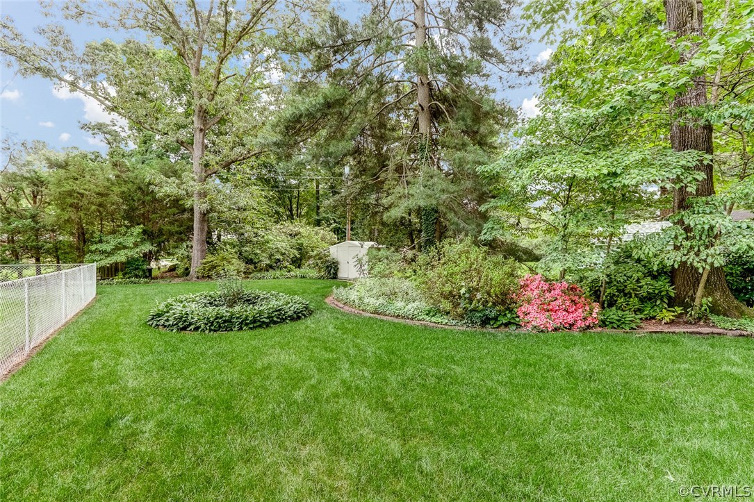 11431 Rochelle Road Chester, VA 23831 - Photo 4 of 23 a view of a garden with large trees