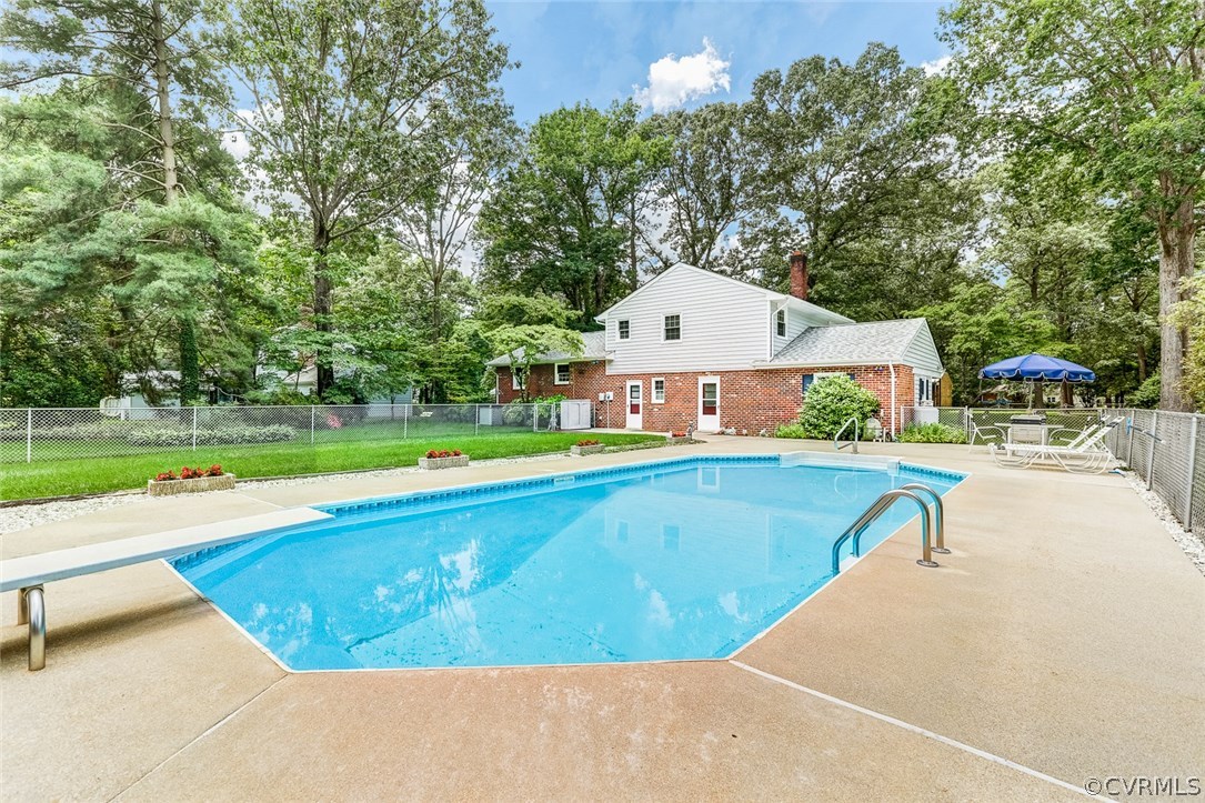 11431 Rochelle Road Chester, VA 23831 - Photo 6 of 23 a view of a swimming pool with a lounge chairs