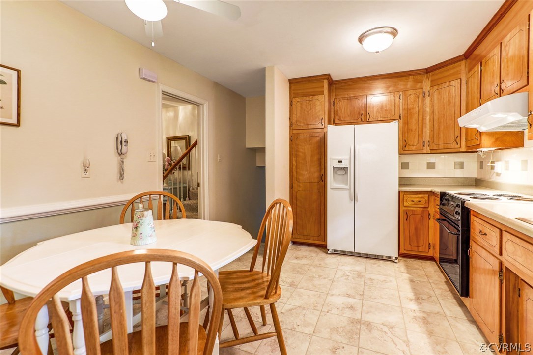 11431 Rochelle Road Chester, VA 23831 - Photo 8 of 23 a very nice looking kitchen with a dining table and chairs