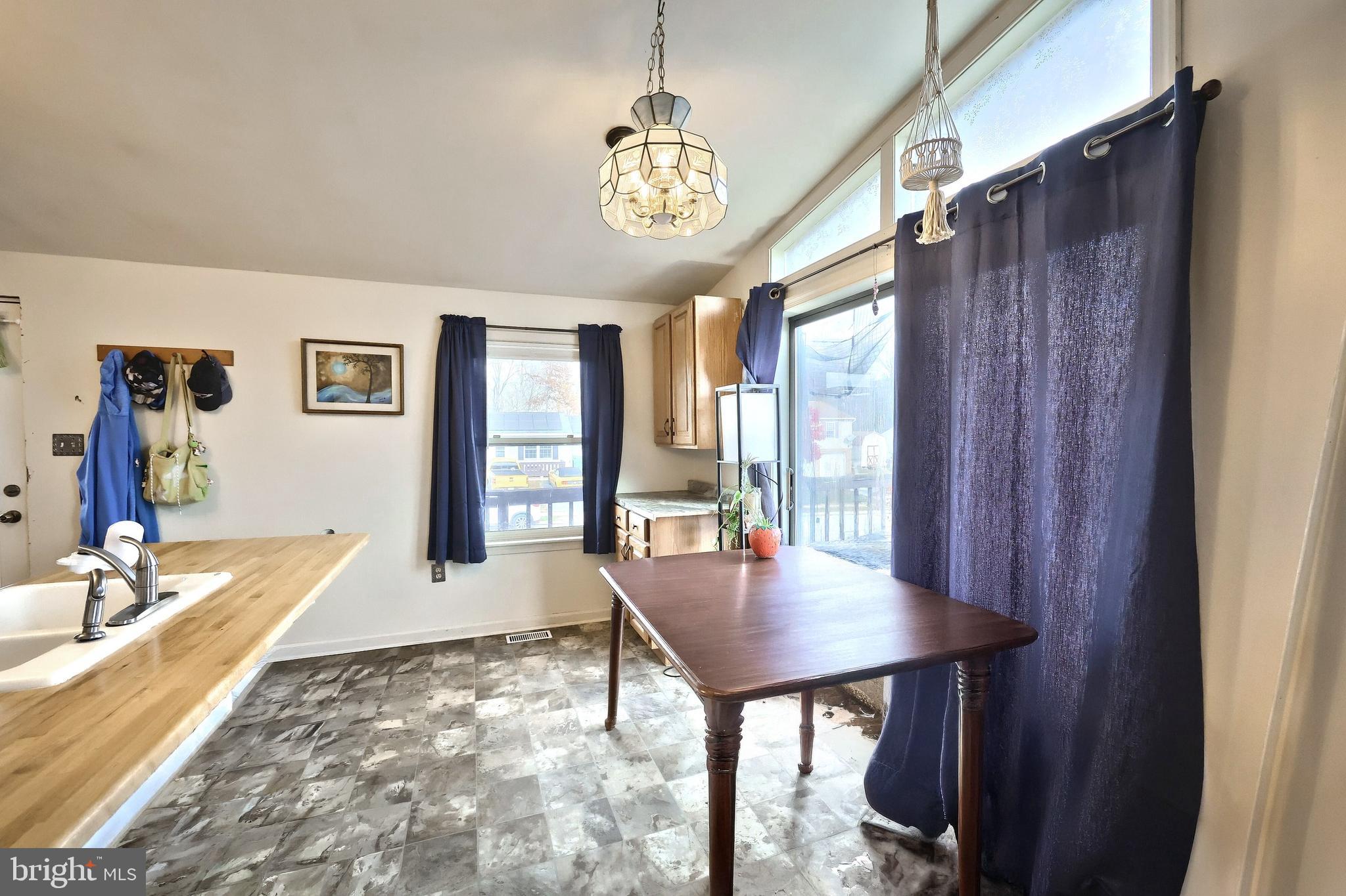 3160 Jessica Road Dover, PA 17315 - Photo 11 of 32 a view of a dining room with furniture window and wooden floor