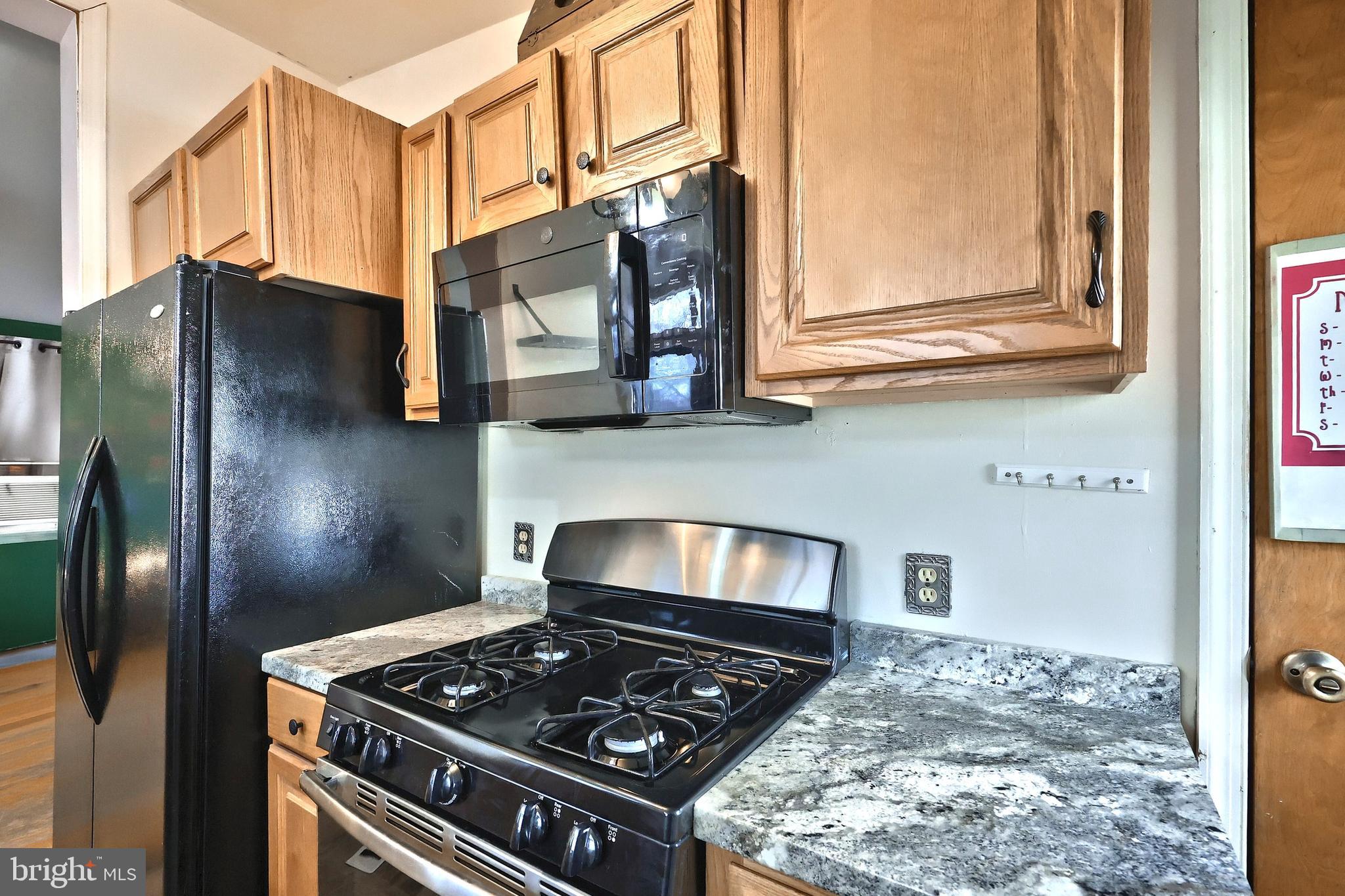 3160 Jessica Road Dover, PA 17315 - Photo 13 of 32 a kitchen with stainless steel appliances granite countertop a stove and a refrigerator