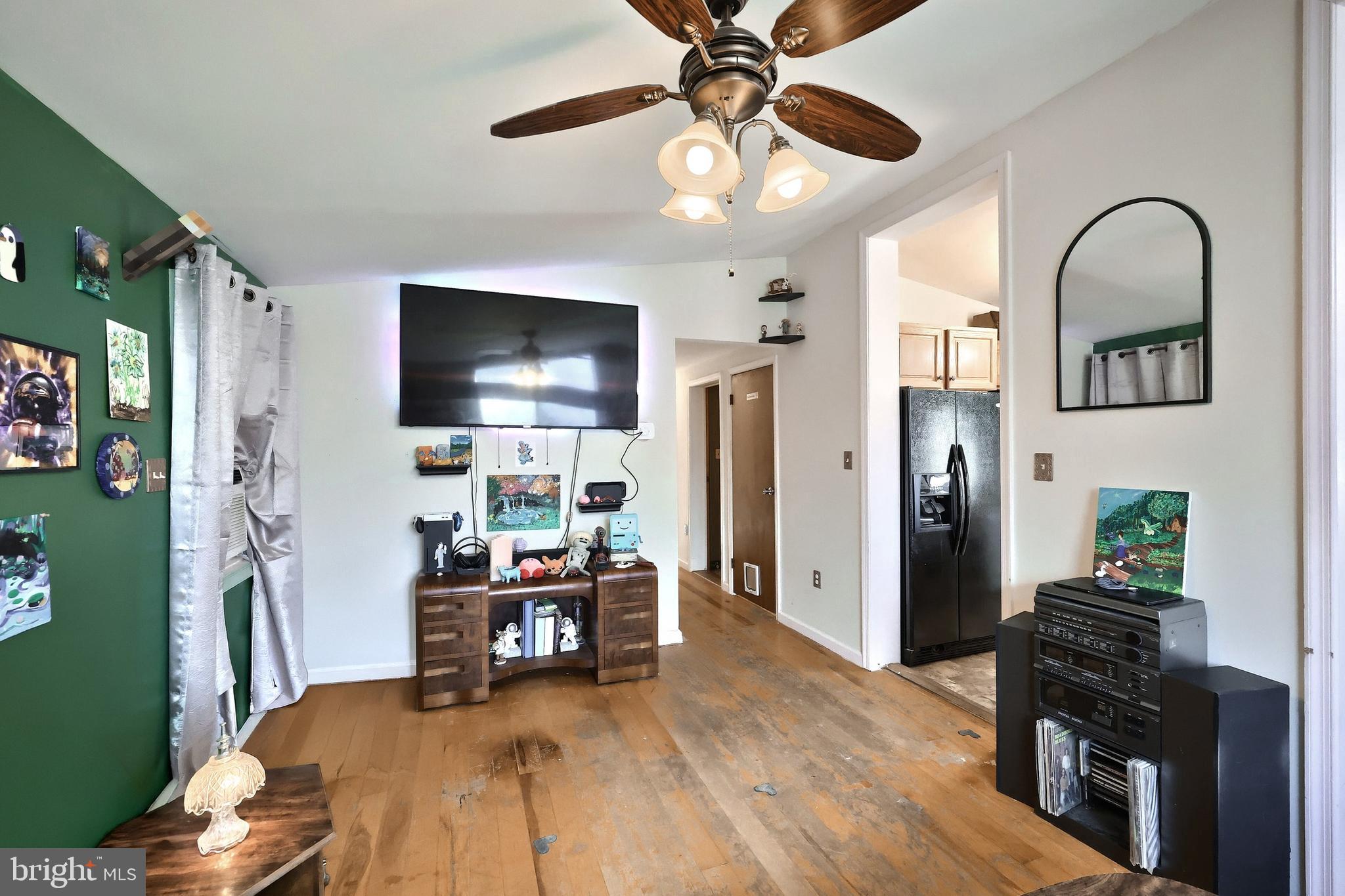 3160 Jessica Road Dover, PA 17315 - Photo 16 of 32 a living room with furniture and a flat screen tv