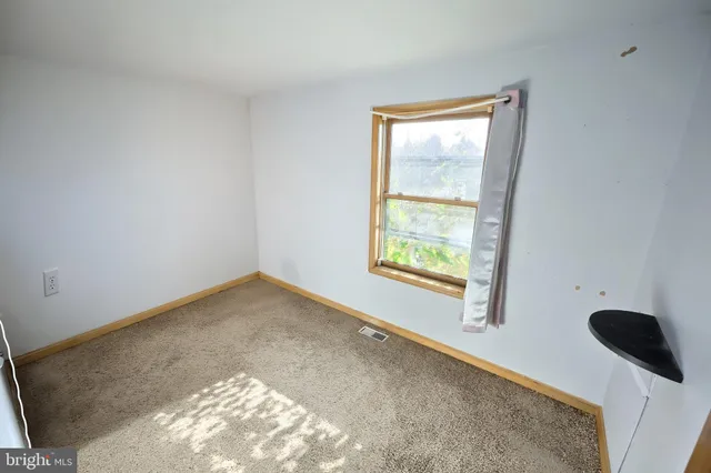 a view of a window in an empty room