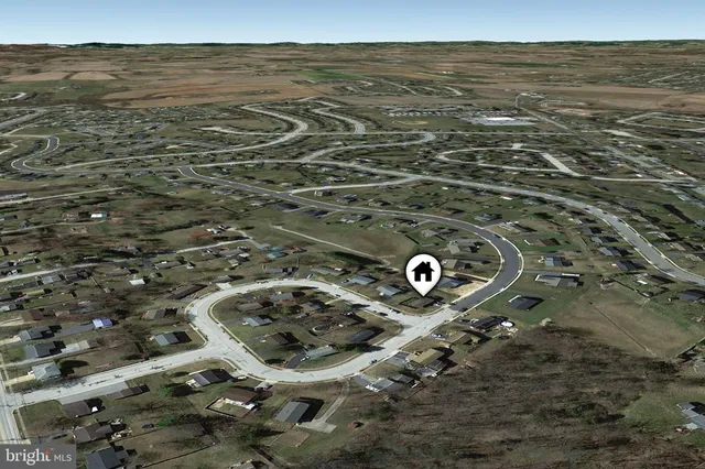 an aerial view of a house with a ocean view