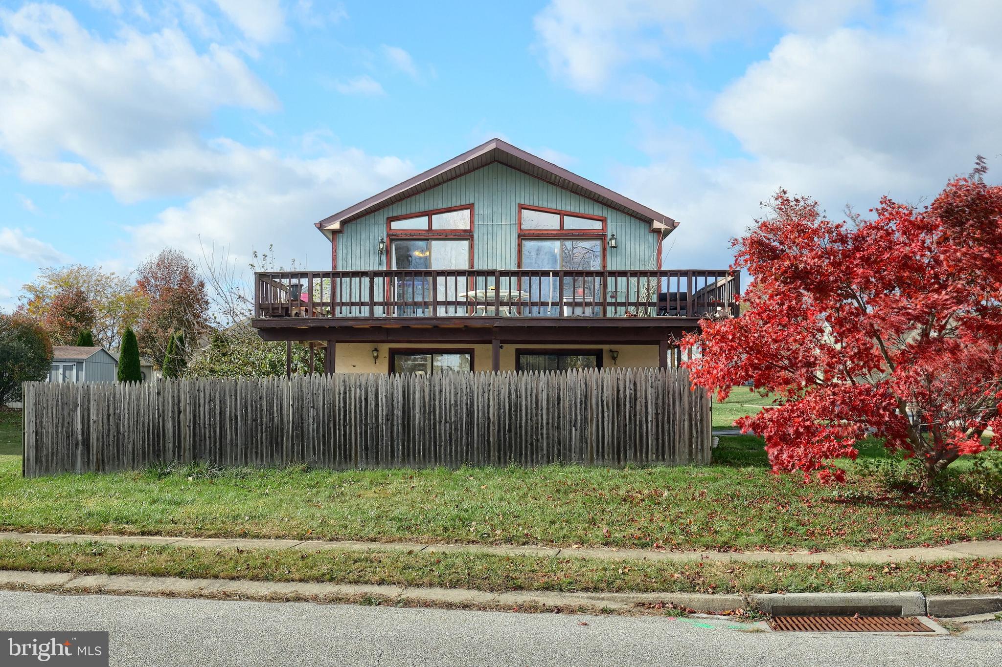 3160 Jessica Road Dover, PA 17315 - Photo 6 of 32 a view of a house with a yard and wooden fence