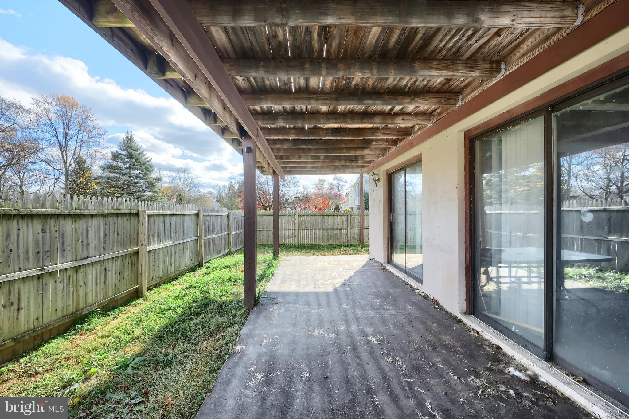 3160 Jessica Road Dover, PA 17315 - Photo 7 of 32 a porch with wooden floor in front of a house