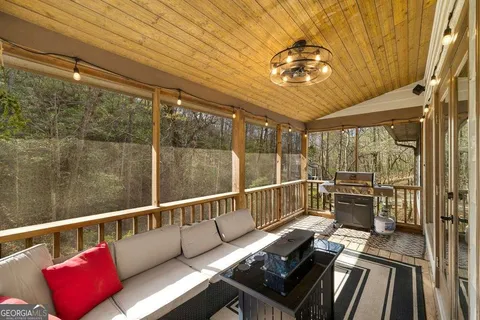 a view of a balcony with furniture
