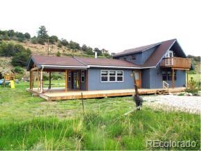 17075 County Road 220 Salida, CO 81201 - Photo 1 of 18 a front view of a house with a yard